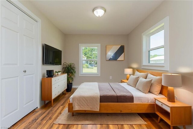 bedroom with wood finished floors