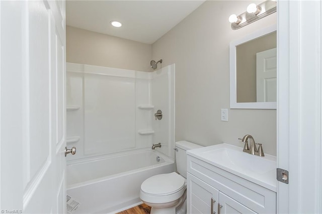 bathroom with toilet, vanity, and shower / bath combination