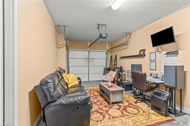 garage featuring a garage door opener and baseboards