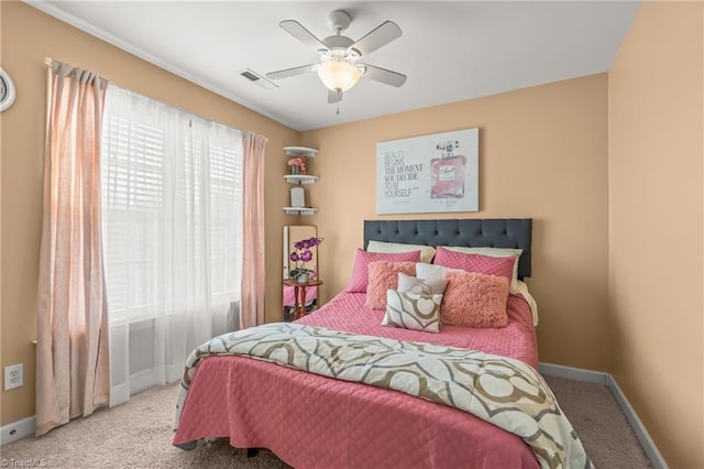 bedroom with visible vents, baseboards, a ceiling fan, and carpet flooring