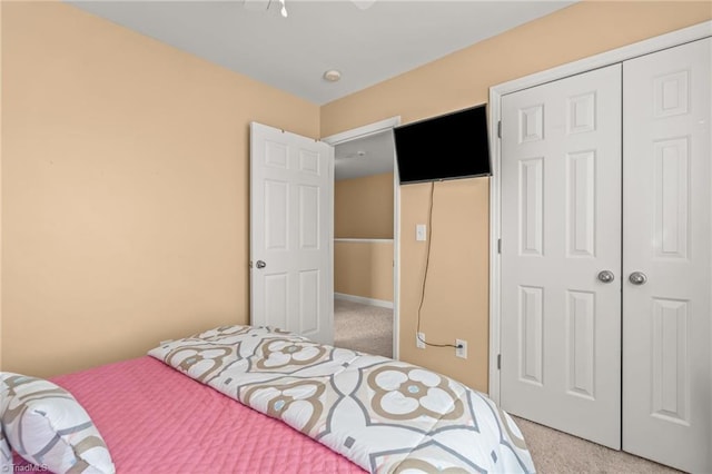 bedroom featuring carpet and a closet