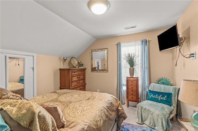 bedroom featuring carpet flooring and vaulted ceiling