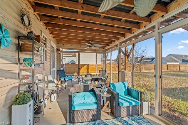 sunroom with a ceiling fan