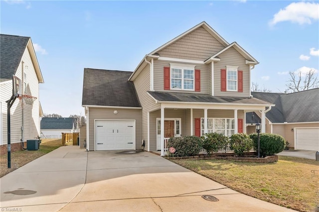 traditional-style home featuring an attached garage, central AC, a front yard, covered porch, and driveway