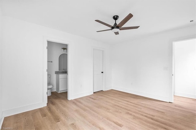 unfurnished bedroom with ensuite bath, ceiling fan, and light hardwood / wood-style floors