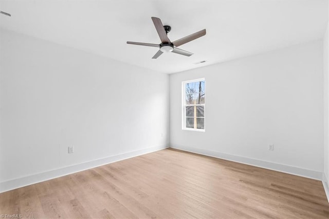 unfurnished room featuring ceiling fan and light wood-type flooring