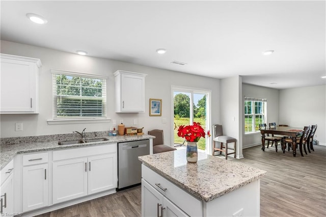 141 Nova Ln, King, NC 27021 - kitchen with dishwasher, a sink, light wood finished floors, white cabinets, and recessed lighting