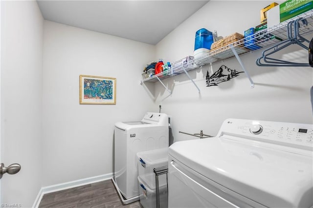 141 Nova Ln, King, NC 27021 - washroom with separate washer and dryer, dark wood-style flooring, and baseboards