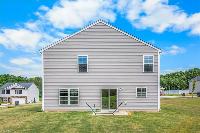 141 Nova Ln, King, NC 27021 - back of house featuring a lawn