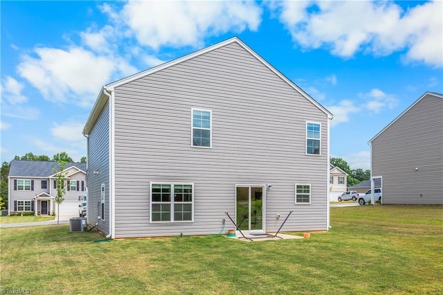 141 Nova Ln, King, NC 27021 - back of house with central AC and a yard