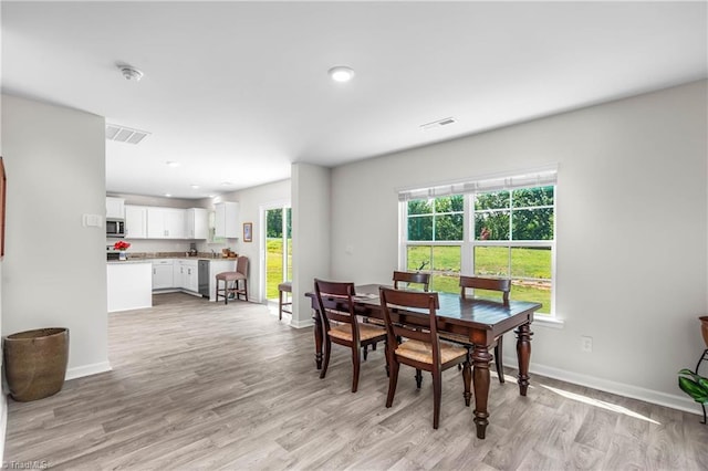 141 Nova Ln, King, NC 27021 - dining area featuring light wood finished floors, baseboards, and recessed lighting