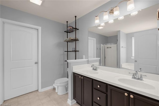 bathroom with toilet, vanity, tile patterned floors, and an enclosed shower