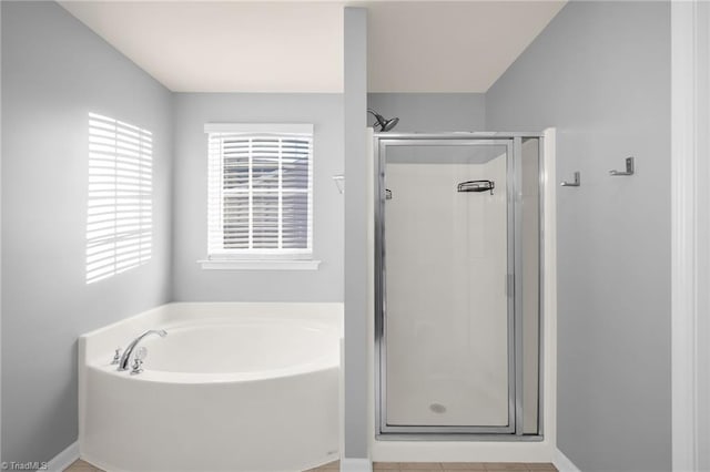 bathroom with shower with separate bathtub