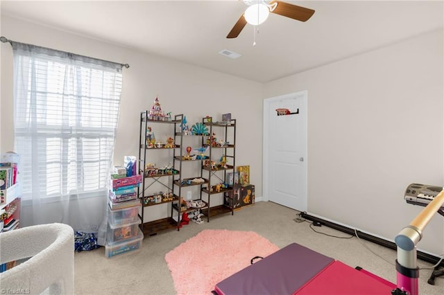 interior space featuring carpet flooring and ceiling fan