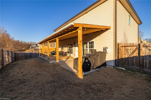 rear view of house with a patio