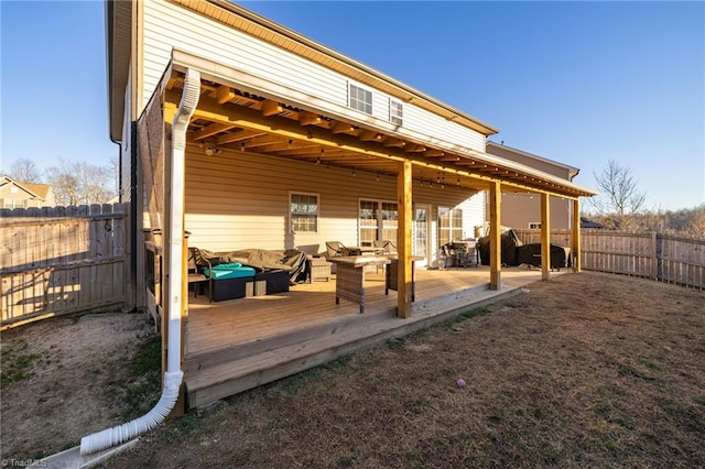 rear view of house featuring outdoor lounge area and a deck