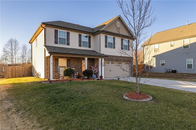 view of front of house with a garage and a front lawn