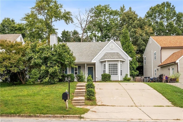 view of front of home featuring central air condition unit, roof with shingles, a chimney, and a front yard