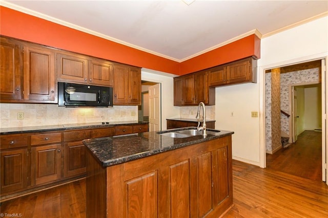 1300 Hobbs Rd, Greensboro, NC 27410 - kitchen with black appliances, a sink, dark wood-type flooring, ornamental molding, and decorative backsplash