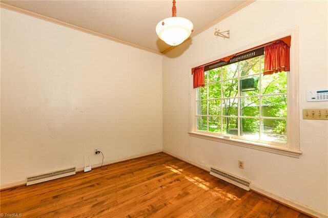 1300 Hobbs Rd, Greensboro, NC 27410 - unfurnished room featuring crown molding, wood finished floors, and baseboards