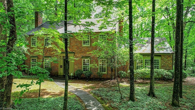 1300 Hobbs Rd, Greensboro, NC 27410 - view of front of property with a chimney and brick siding