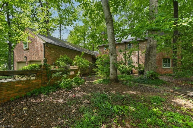 1300 Hobbs Rd, Greensboro, NC 27410 - view of yard with fence and an attached garage