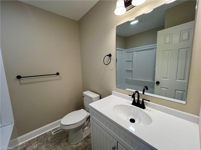 full bathroom featuring toilet, visible vents, vanity, baseboards, and walk in shower