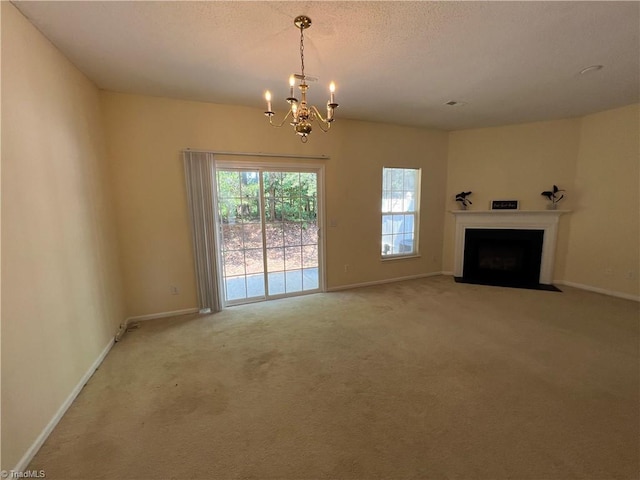 3931 Fountain Village Ln, High Point, NC 27265 - unfurnished living room with a chandelier, carpet, baseboards, and a fireplace with flush hearth