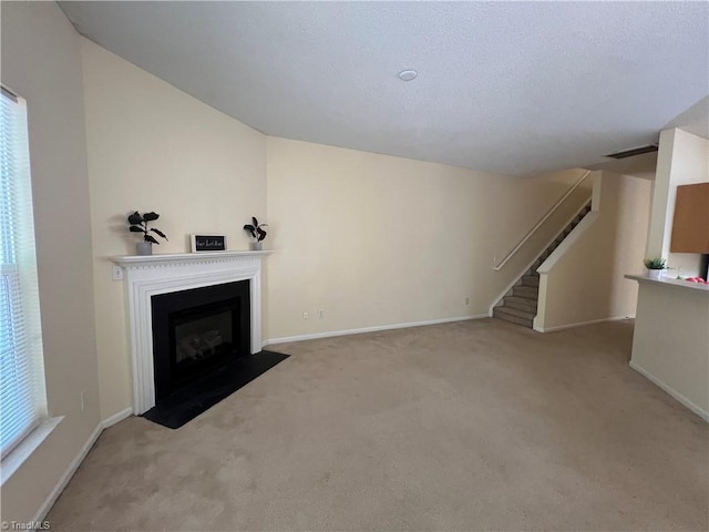 3931 Fountain Village Ln, High Point, NC 27265 - unfurnished living room featuring carpet floors, stairway, a fireplace with flush hearth, and baseboards