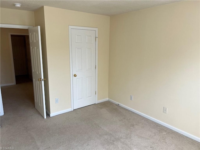 3931 Fountain Village Ln, High Point, NC 27265 - unfurnished bedroom with carpet flooring and baseboards