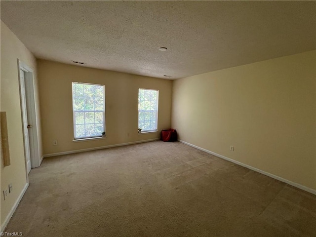 3931 Fountain Village Ln, High Point, NC 27265 - carpeted spare room with a textured ceiling and baseboards
