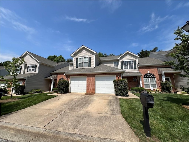 3931 Fountain Village Ln, High Point, NC 27265 - traditional home with brick siding, driveway, and a front lawn