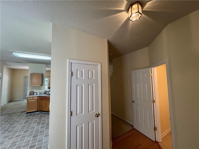 3931 Fountain Village Ln, High Point, NC 27265 - corridor featuring a textured ceiling and baseboards