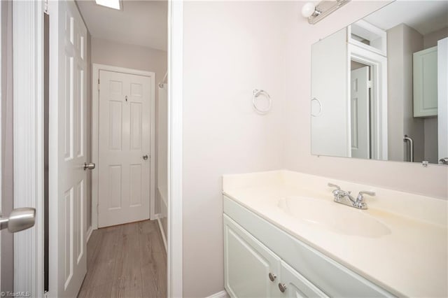 bathroom featuring hardwood / wood-style floors and vanity