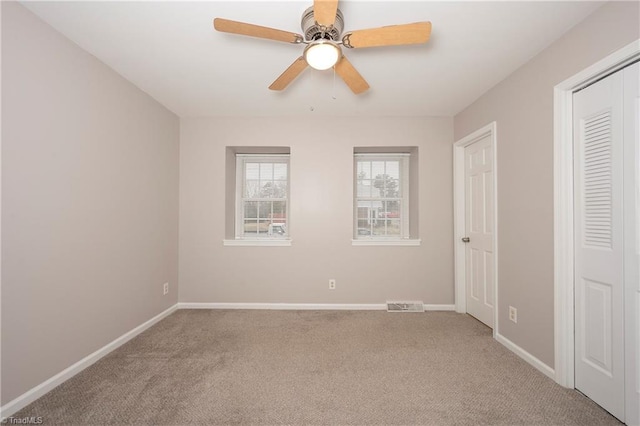 unfurnished bedroom featuring ceiling fan and carpet floors