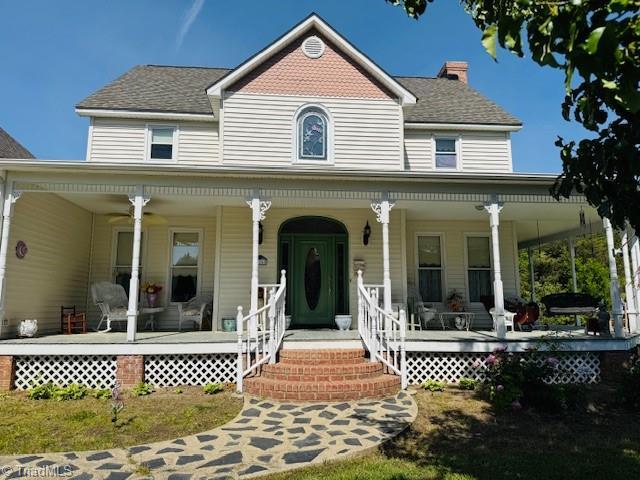 526 Bob Rainey Trl, Burlington, NC 27217 - victorian-style house featuring a porch, a chimney, and a shingled roof