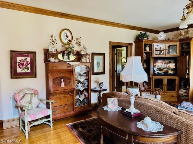 526 Bob Rainey Trl, Burlington, NC 27217 - living area featuring crown molding and wood finished floors