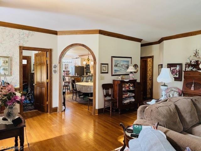 526 Bob Rainey Trl, Burlington, NC 27217 - living room with wood finished floors, ornamental molding, arched walkways, and baseboards