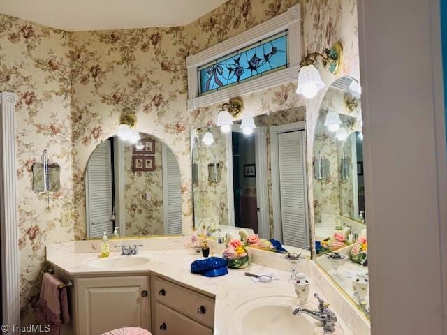 526 Bob Rainey Trl, Burlington, NC 27217 - full bath featuring wallpapered walls, double vanity, and a closet