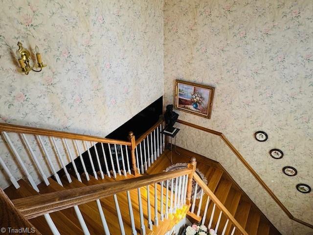 526 Bob Rainey Trl, Burlington, NC 27217 - stairway featuring wallpapered walls