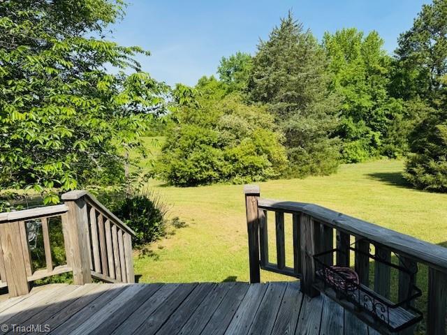 526 Bob Rainey Trl, Burlington, NC 27217 - wooden terrace featuring a yard