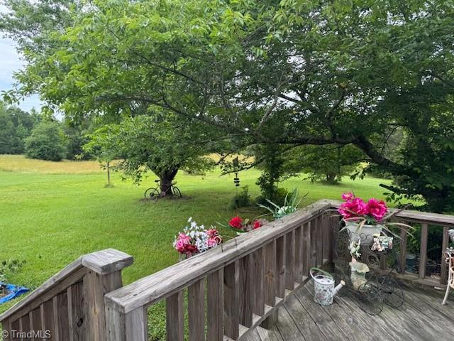 526 Bob Rainey Trl, Burlington, NC 27217 - wooden deck with a lawn