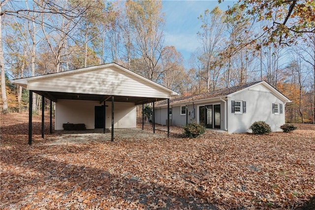 view of side of home featuring a carport