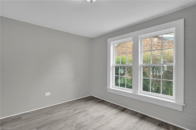 unfurnished room featuring hardwood / wood-style flooring