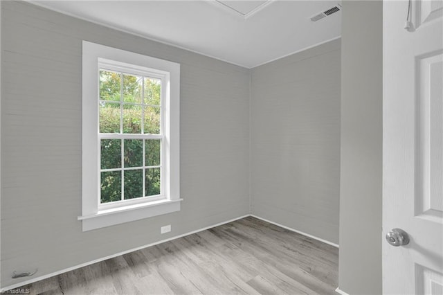 unfurnished room with light wood-type flooring