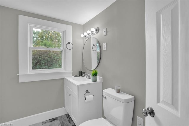 bathroom featuring toilet and vanity