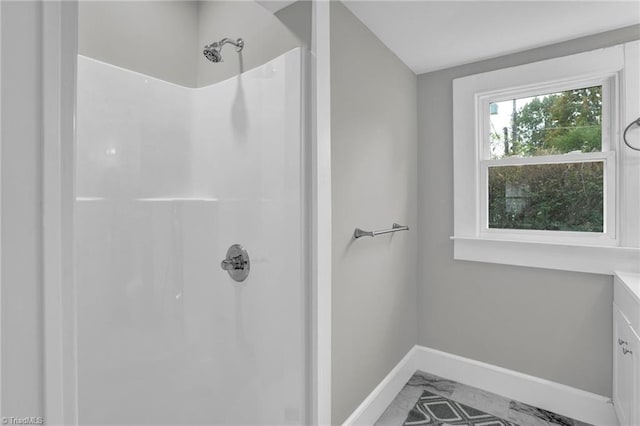 bathroom featuring walk in shower