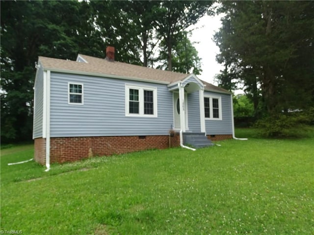 1865 E US Highway 64, Lexington, NC 27292 - view of front of house featuring a front yard, crawl space, and a chimney