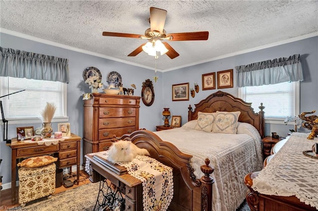 bedroom featuring ceiling fan, crown molding, hardwood / wood-style floors, and a textured ceiling