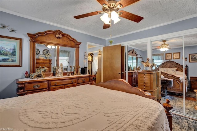 bedroom featuring ceiling fan, ornamental molding, and a textured ceiling